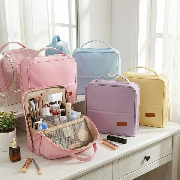 A beautiful vanity setup featuring the Sunday Status travel makeup bag collection in pastel pink, light blue, purple, and yellow.