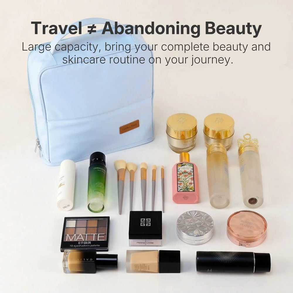 An open black Sunday Status stand-up travel makeup bag displayed on a luxurious golden silk background. It is surrounded by a perfectly organized flatlay of cosmetics, including dozens of makeup brushes, lipsticks, palettes, and full-sized skincare bottles, showcasing its massive packing capacity