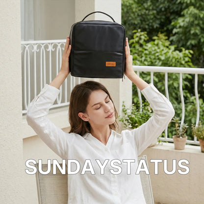 A young woman holding a black Sunday Status travel makeup bag over her head in a bright balcony setting, representing the brand's premium outdoor leisure lifestyle