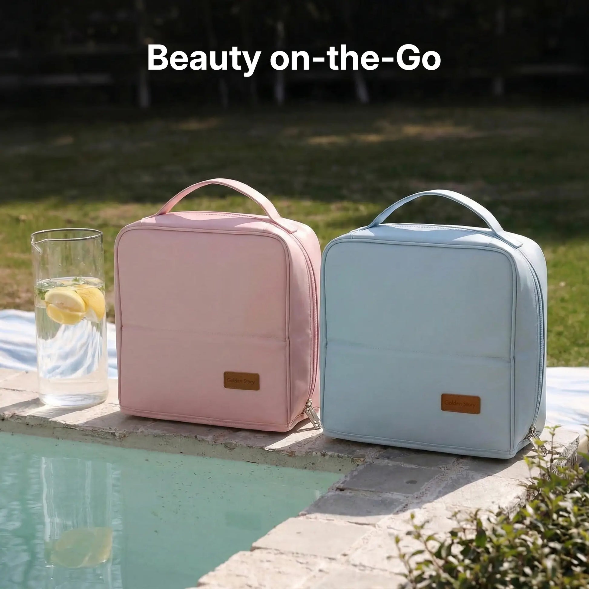 Pastel pink and light blue Sunday Status travel makeup bags sitting on a poolside ledge, showcasing their stylish 'Beauty on-the-Go' design for outdoor leisure and vacations