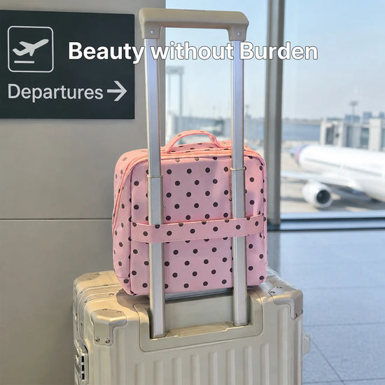 Soft Rose Artist Vanity secured to rolling luggage with its rear trolley sleeve
