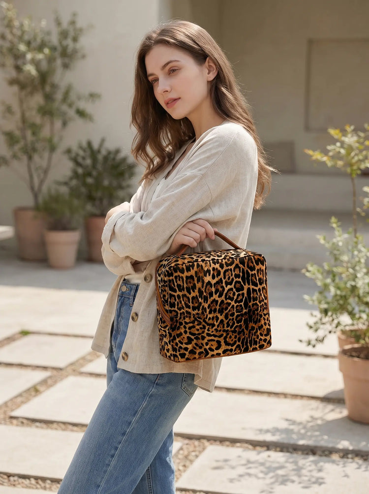 Woman carrying the Wild Leopard Essential Vanity outdoors