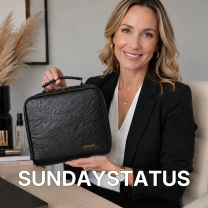 Woman carrying the Midnight Black Grand Vanity large travel makeup case